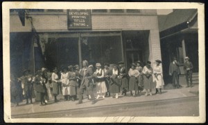 group of actors outside Courier Motion Picture Corp